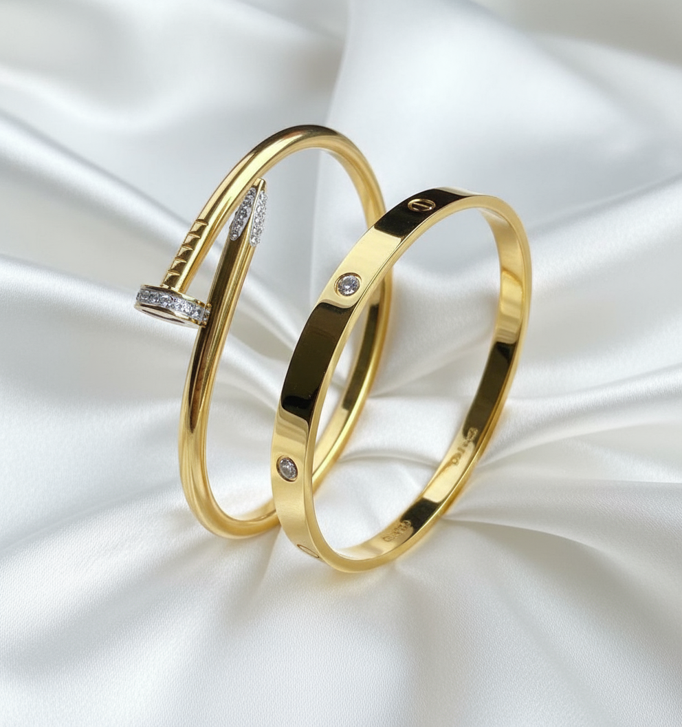 Two Distinctive Gold Bangles on White Satin